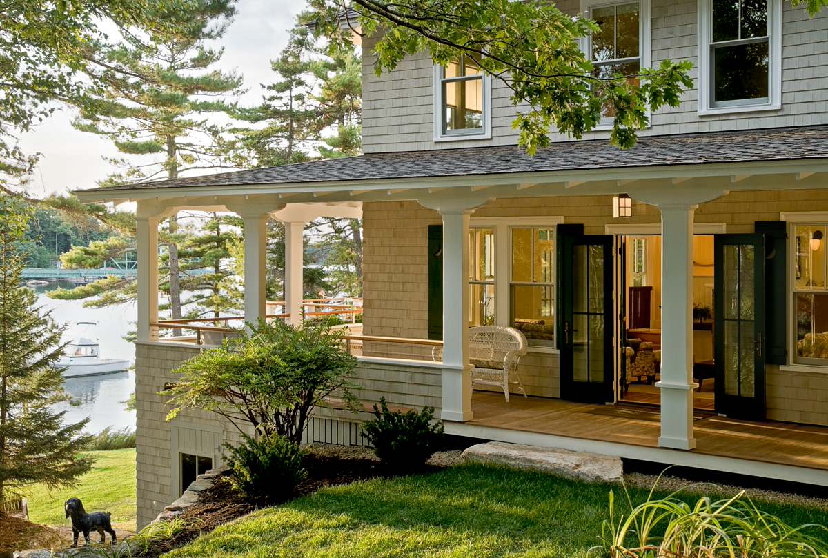 A tropical beach house featuring wraparound porches, providing shaded areas for outdoor relaxation and enjoying the breeze