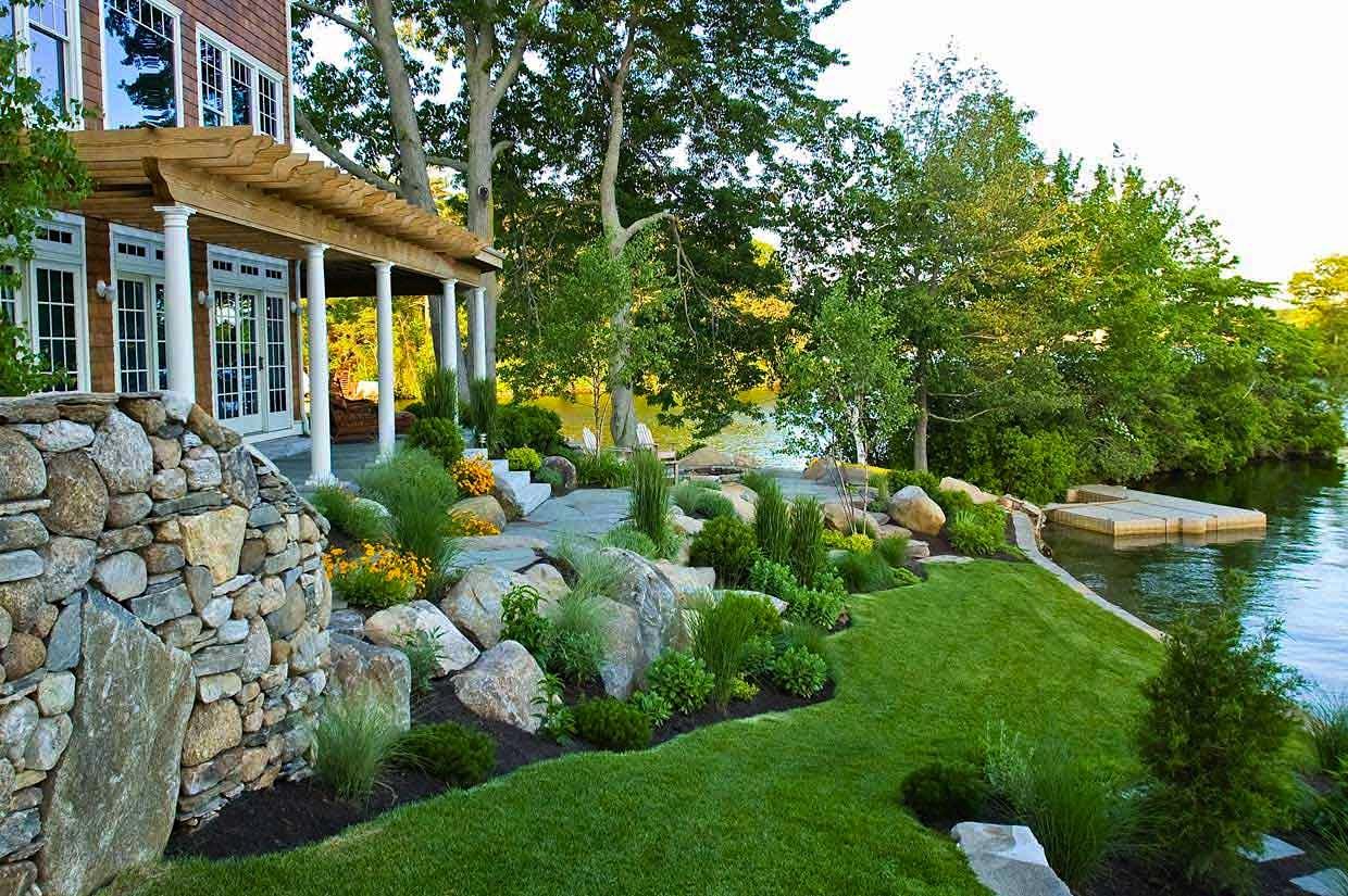 Coastal protection design with sloped landscaping, focusing on grading and drainage to prevent erosion effectively
