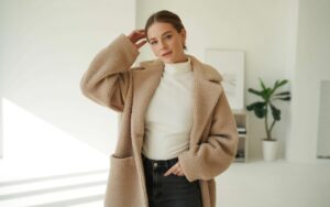 A woman posing wearing teddy coat