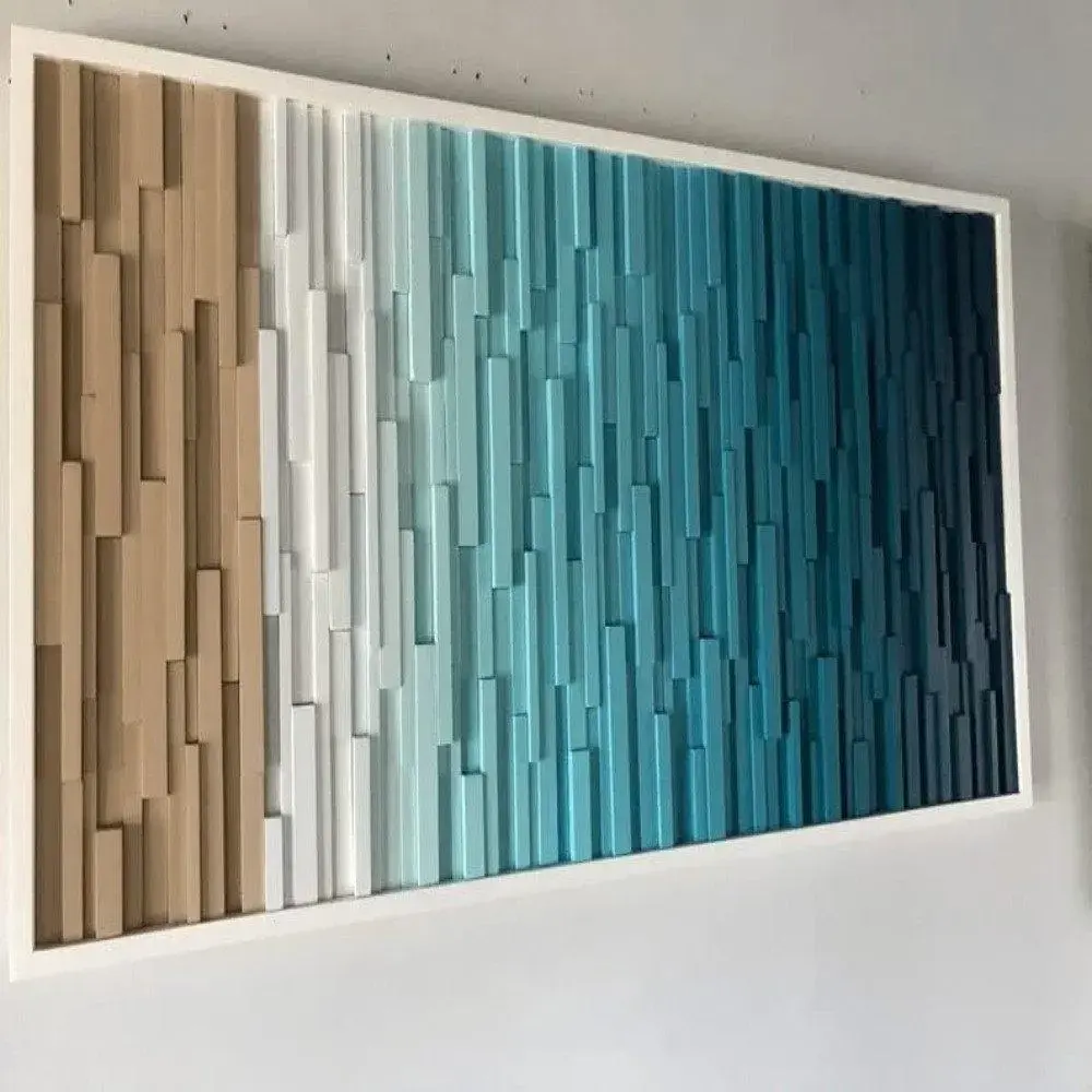 Beach-themed wall art displayed in a bedroom, hung with clips and washi tape for a casual, creative look