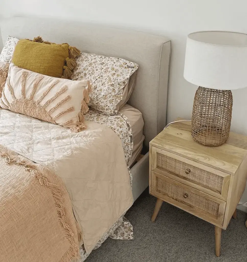  A cozy bedroom featuring earthy tones, rattan accents