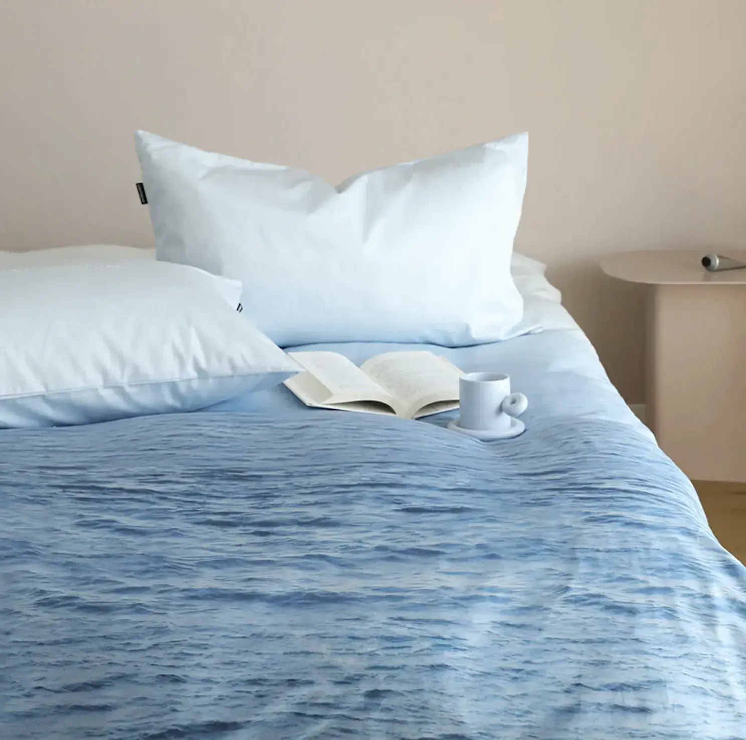 Ombre bedding featuring a gradient from deep navy to soft aqua