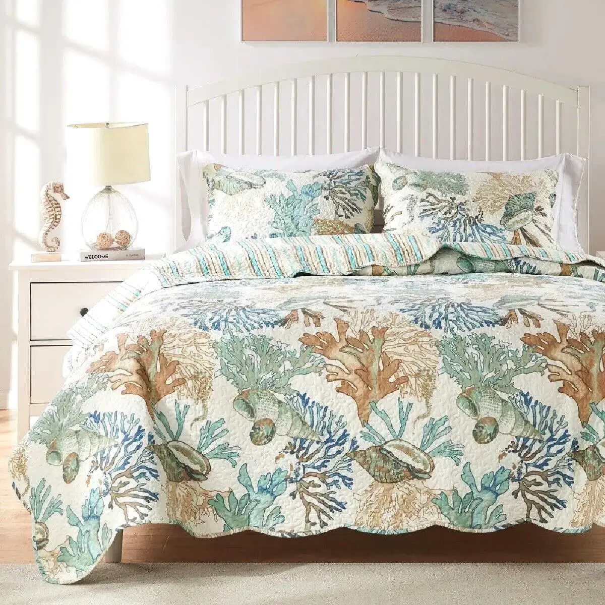 Coastal bedding with cozy handmade quilts with coastal-inspired embroidery and patchwork