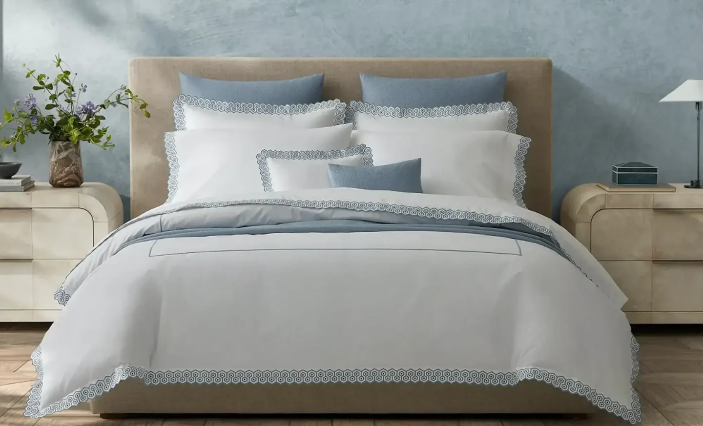 Light-colored cotton bedding enhances a beach-themed bedroom