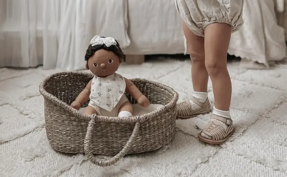 Decorative wicker basket with a plushy doll