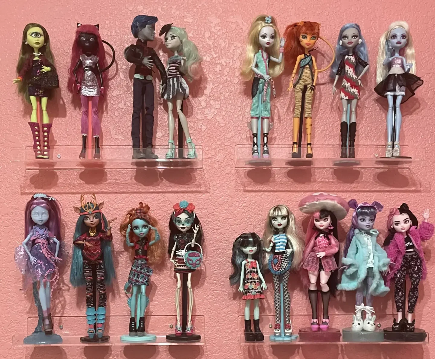  Floating wall shelves displaying a variety of colorful dolls in different poses and outfits